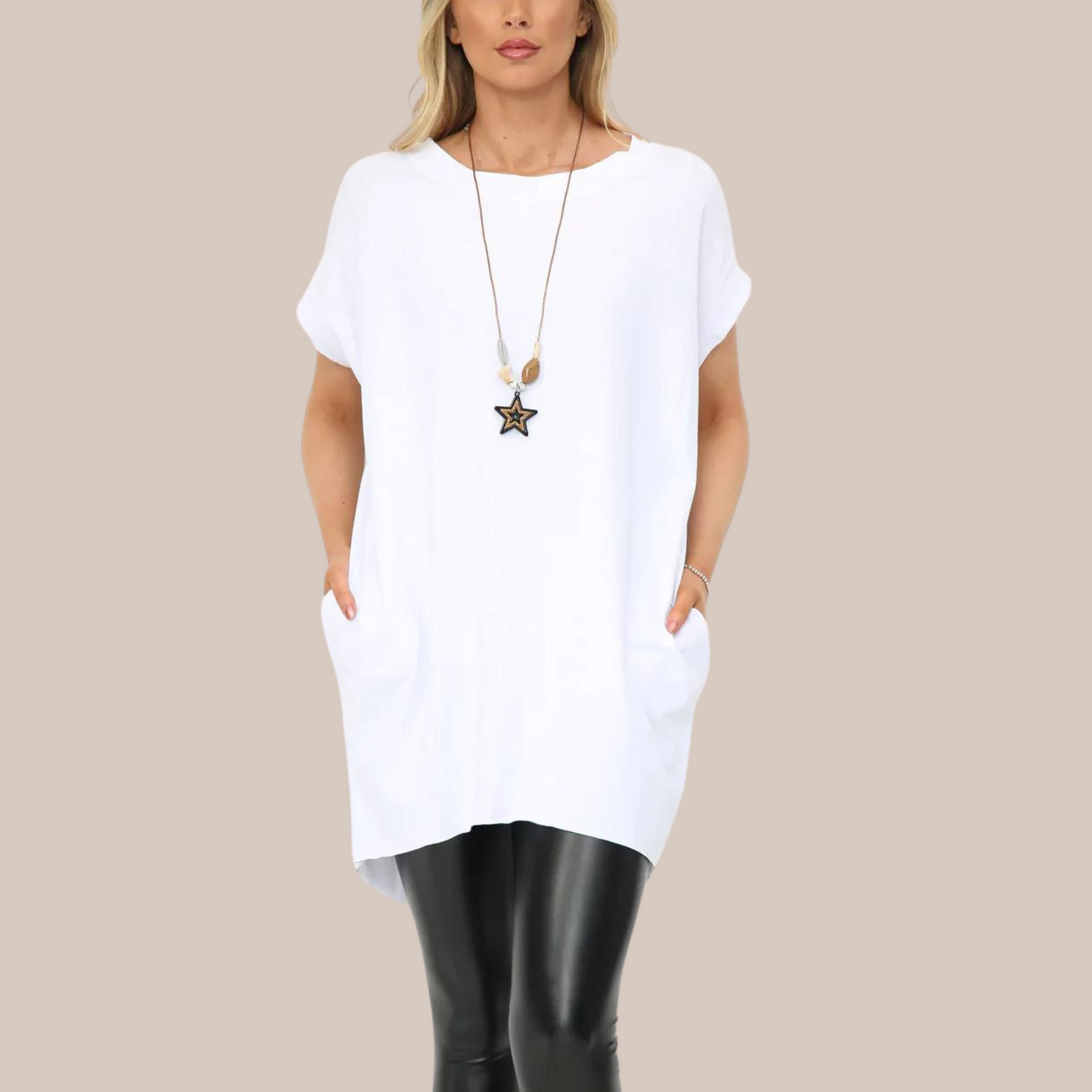 Long t-shirt with pockets. Available in various colours. Necklace included