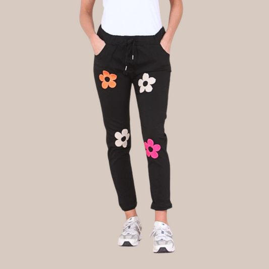 Flower motive magic stretch trousers. Available in various colours.