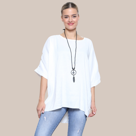 Batwing sleeve plain blouse with a pretty necklace .